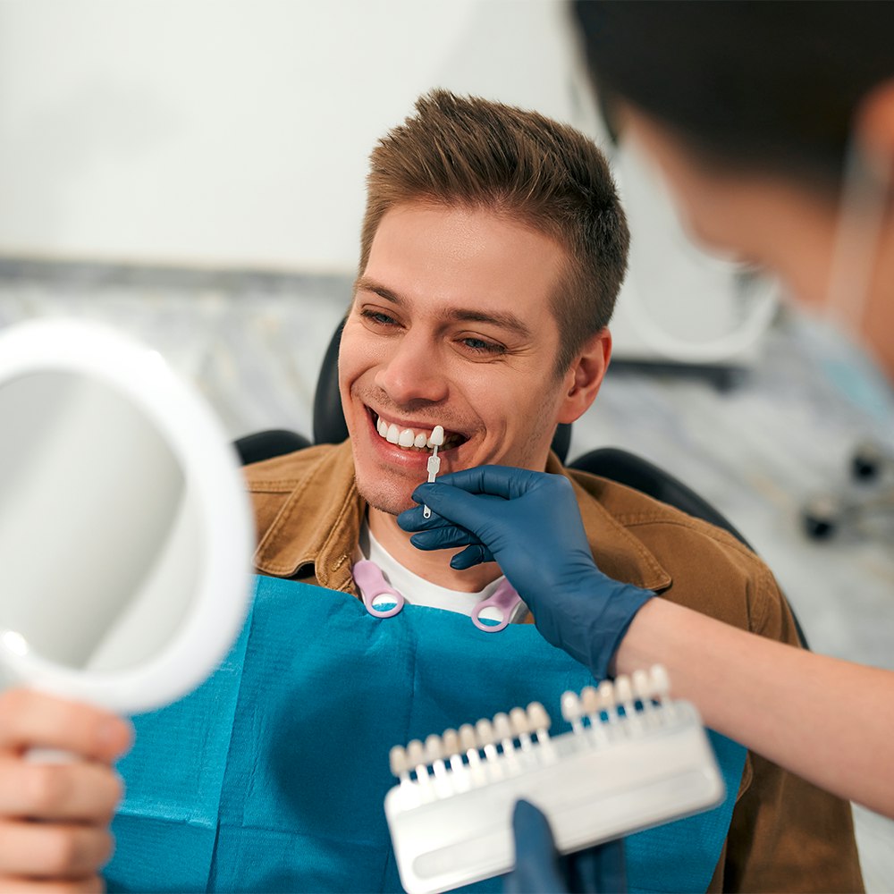 man trying on veneers