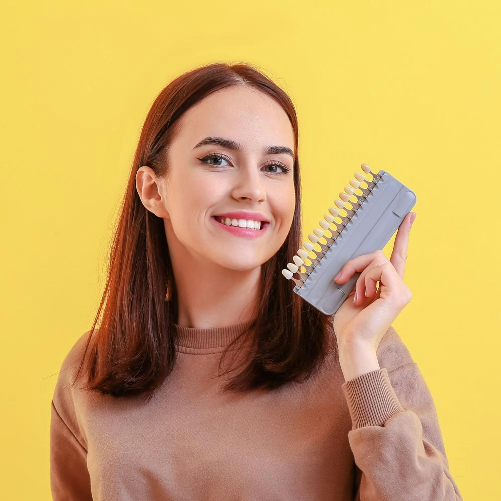 woman holding veneers